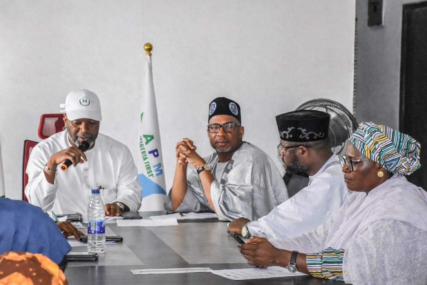 APM officials meeting around a conference table